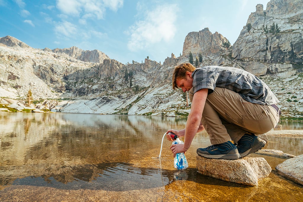 using backpacking water filter to fill collapsible water bottle