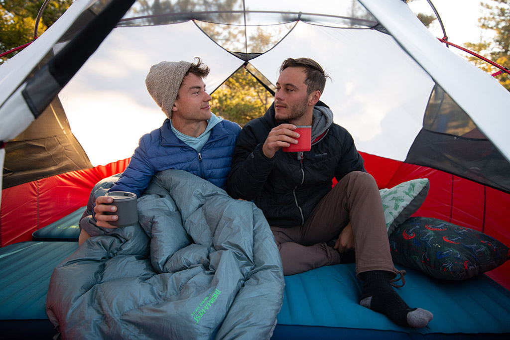 two men on camping mattress