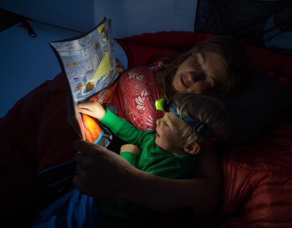 reading in tent with toddler