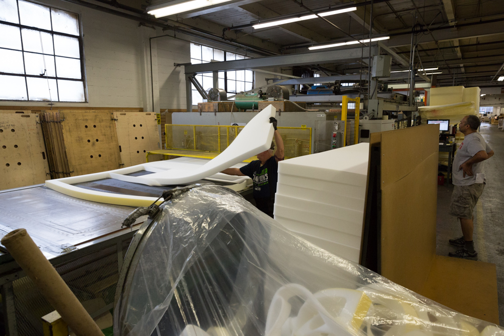 Cutting self inflating mattresses foam in Therm-a-Rest factory