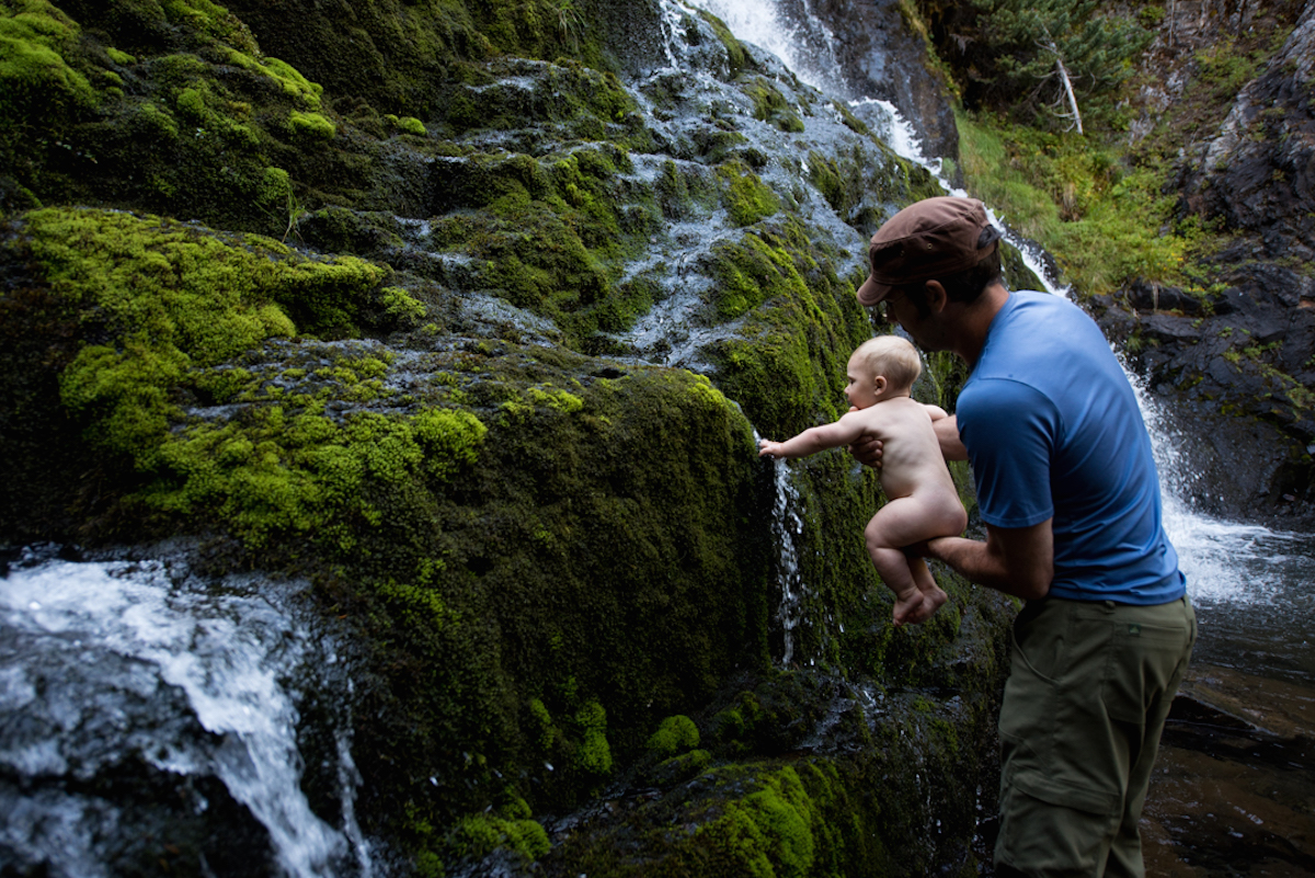 baby and dad in waterfall