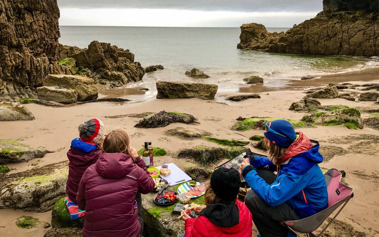 family eating and beach camping