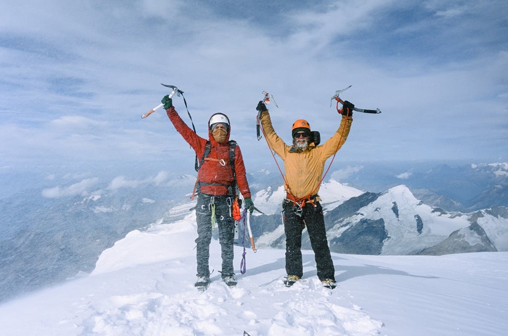 Climbers standing on top of the summit of Mount Robson