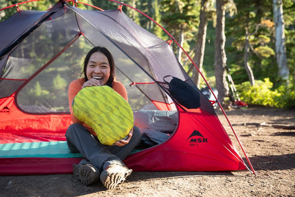 inflating pillow in tent