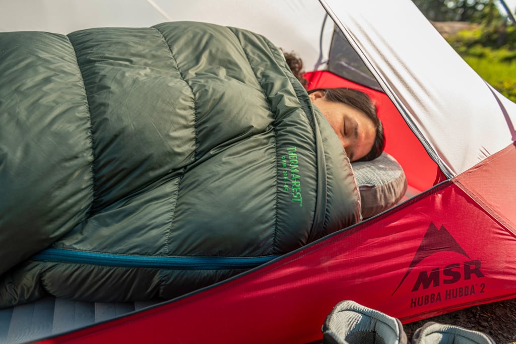 Woman sleeping in tent