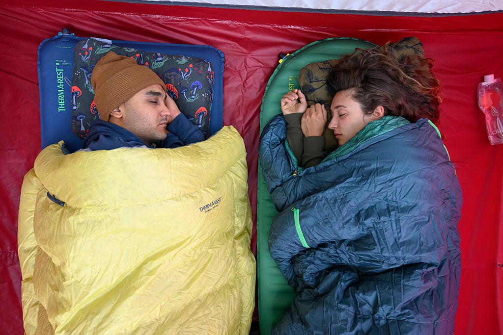 sleeping in tent with camping pillows and sleeping bags