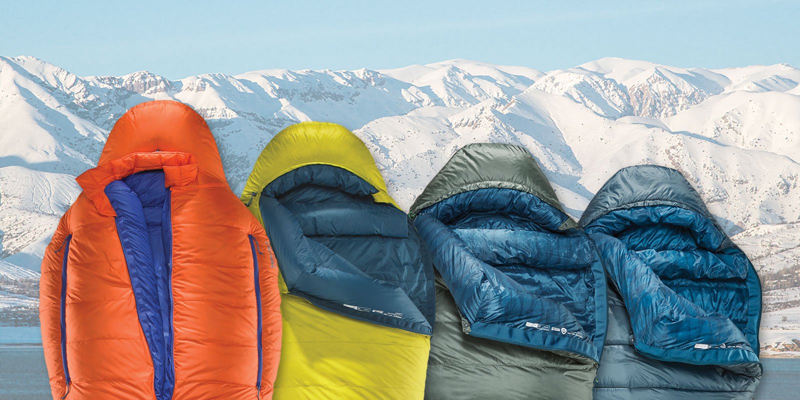 4 Sleeping bags over a snowy mountain background