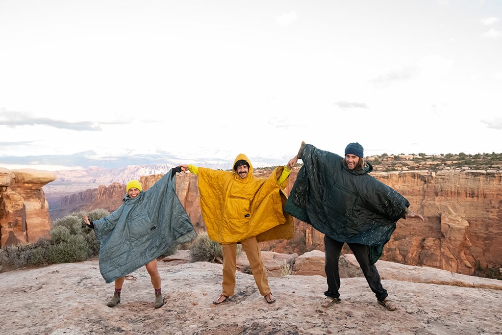 standing in ponchos