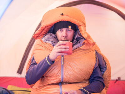 Eric Larsen drinking coffee in the Polar Ranger