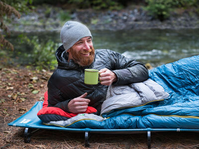 Camper detail, drinking coffee on Mesh Cot